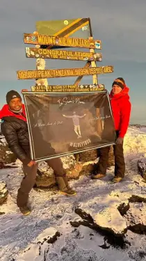 Click Here To Enlarge This Photo Of In Sam's Name Flag flies at the summit of Kilimanjaro