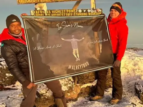 In Sam's Name Flag flies at the summit of Kilimanjaro