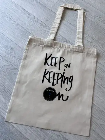 In Sam's name "Keep on Keeping on" Tote Bag